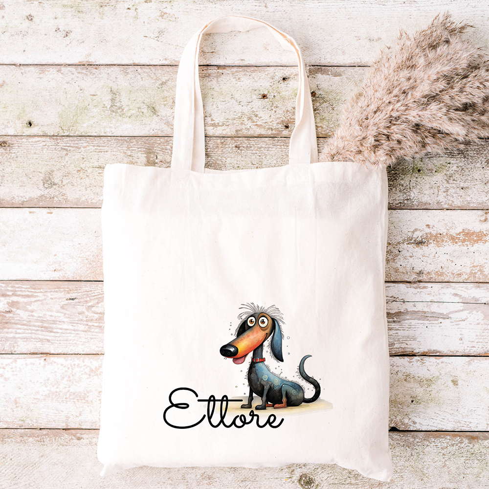 Tote bianca con bassotto cartoon e scritta "Ettore", raffigurata su legno: un divertente abbinamento con lo Specchietto Tondo di In Casa di Ale per uno stile coordinato e personalizzato.